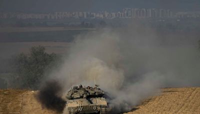 The Latest | Israeli troops launch attacks in central Gaza, possibly widening their offensive