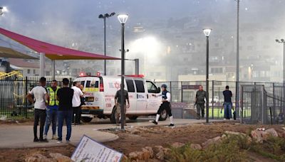 Israeli authorities say at least 11 people killed in rocket attack on football pitch in Israeli-occupied Golan Heights