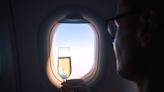 Why You Should Never Sleep After Drinking Alcohol on a Plane, According to Health Experts