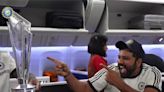 ...Rohit Sharma, Virat Kohli, Jasprit Bumrah Mesmerised by T20 World Cup Trophy as They Celebrate Inside Air India Flight - News18...