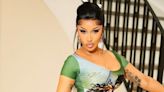 Cardi B’s preppy grunge look’s colour palette matches her thigh tattoo