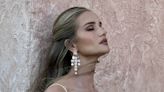 Rosie Huntington-Whiteley flaunts her figure in a white D&G gown