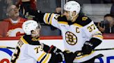 McAvoy scores in OT, Bruins beat Flames for 8th win a row