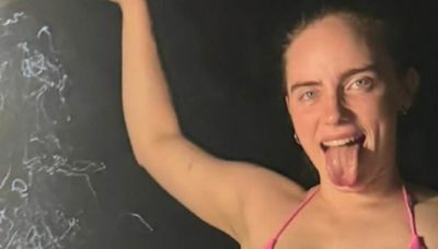 Billie Eilish puts on a very busty display in a RARE bikini snap