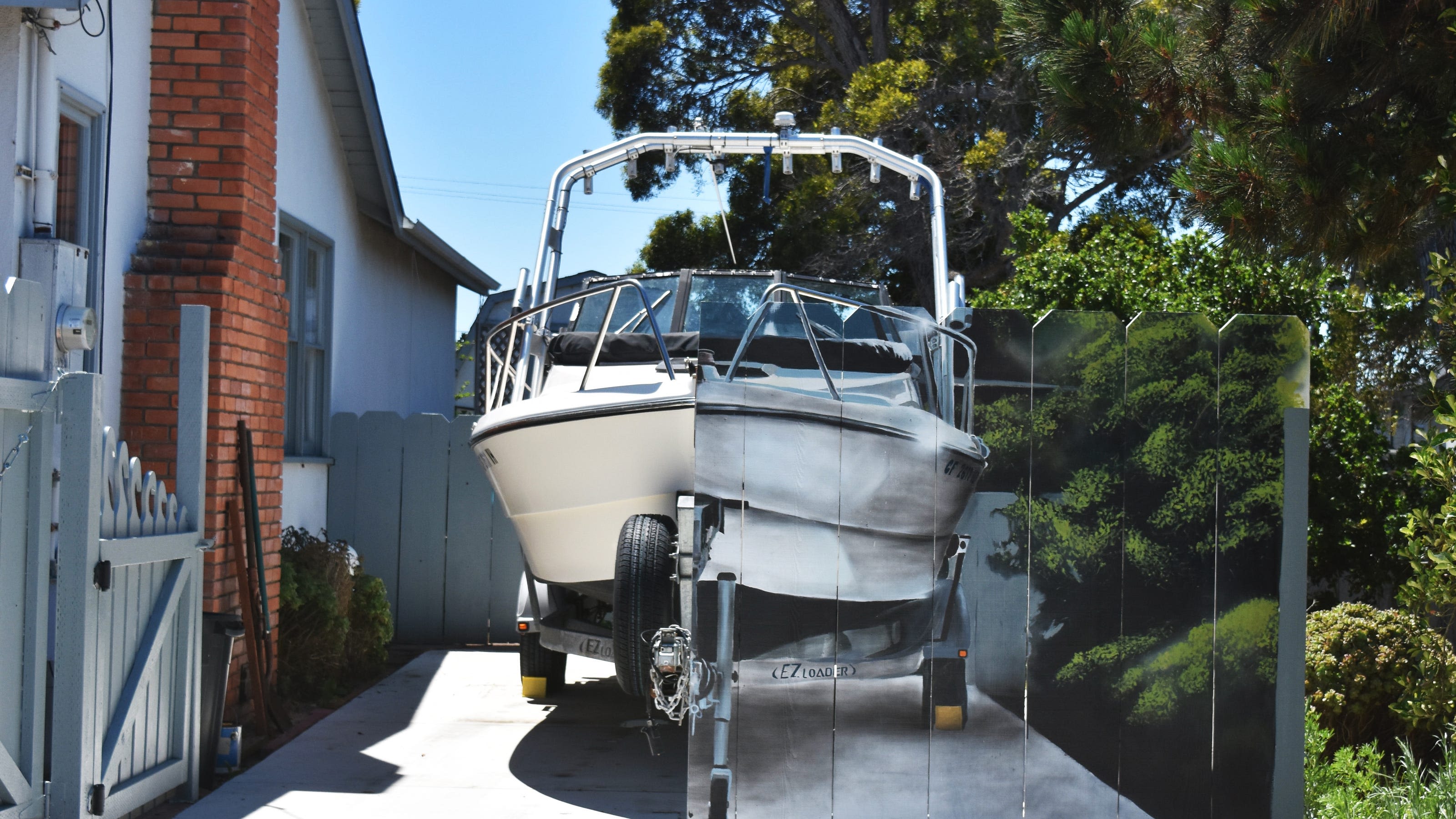 No boats? OK. A clever California homeowner paints a mural to hide a boat in his driveway