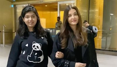 Aishwarya Rai Bachchan takes selfies with paparazzi as she returns to Mumbai with Aaradhya after Paris Fashion Week. See here