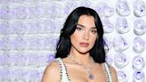 Dua Lipa's black cut out dress is a sight to behold, and fans have gone wild