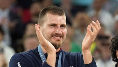 A wobbly Nikola Jokic delightfully received his Olympic bronze alongside his Serbian teammates