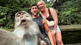 Monkey see, monkey do! Stunned tourists photobombed by selfie-taking macaque in Bali