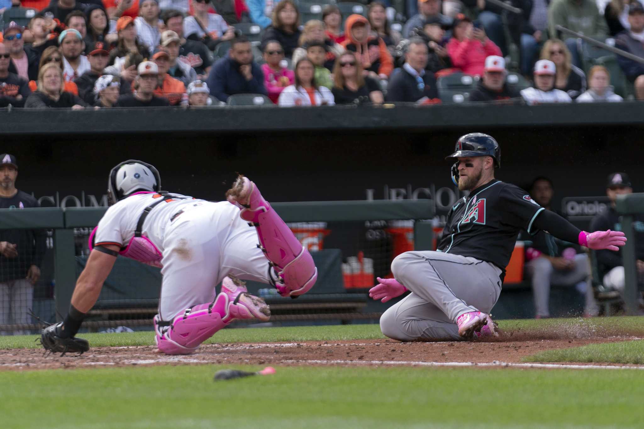 Diamondbacks avoid a sweep with a 9-2 victory on an unusually sloppy day for the Orioles