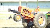 Antique tractors pull in a crowd during 22nd Crawford Farm Machinery Show