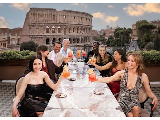 ‘Emily in Paris’ Season Four Part Two Launches in Rome With Cast Posing by the Colosseum and a Fleet of Vintage Fiat 500 Cars...