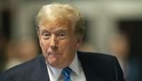 Former US President Donald Trump speaks to the press at the end of the day of his trial for allegedly covering up hush money payments linked to extramarital affairs, at Manhattan Criminal Court in...