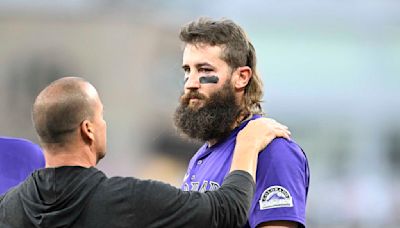 Rockies DH Blackmon leaves game vs. Padres after getting hit on left wrist, left eye by errant throw