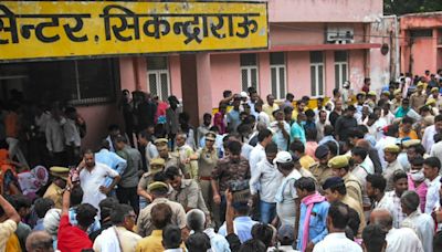 Scores of people fell to their deaths in an open sewer during crush at religious event in India