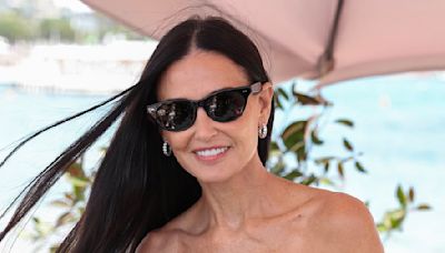 Demi Moore cradles her beloved Chihuahua Pilaf at an event in Cannes