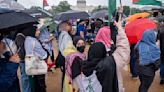 Hundreds of pro-Palestinian protesters rally in the rain in DC to mark a painful present and past