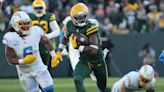 Rookie Dontayvion Wicks shines for Packers on day he pays tribute to college teammates killed in shooting last year at Virginia