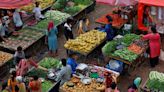 India's retail inflation reignites in June as food prices surge