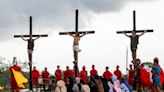 Philippines' Catholic devotees nailed to crosses to re-enact crucifixion