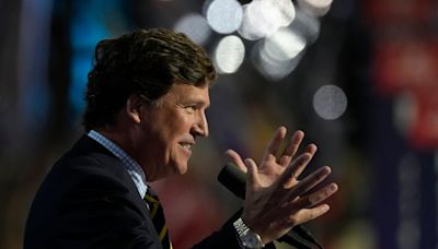 Tucker Carlson briefly overtakes Joe Rogan for top Spotify podcast