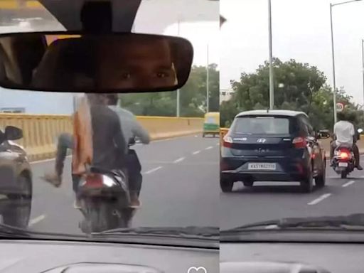 Watch: Bengaluru youth kick moving Grand i10 from scooters, arrested - Times of India