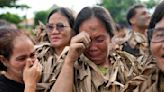 Philippine villagers smear mud on their bodies to show devotion to St. John the Baptist