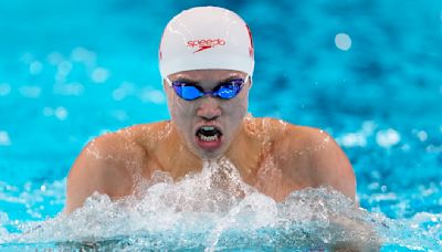 Another Chinese Olympic swimming medalist linked to doping scandal denies any wrongdoing