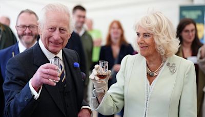 King Charles and Queen Camilla enjoy a glass of whisky in Edinburgh