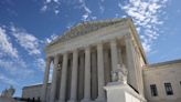 Under fire, US Supreme Court unveils ethics code for justices