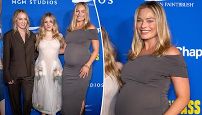 Margot Robbie shows off baby bump in second-skin dress on first red carpet since announcing pregnancy