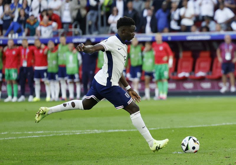 Soccer-Euro 2020 penalty abuse forgotten, Saka is toast of England