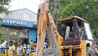 A rare sight in Calcutta: Bulldozers on roads pull down illegal shops