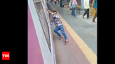 Video of train stunt at Sewri station viral, FIR against youth | Mumbai News - Times of India