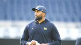 1st-year head coach Sherrone Moore looking at Michigan Wolverines’ quarterback during today’s spring game