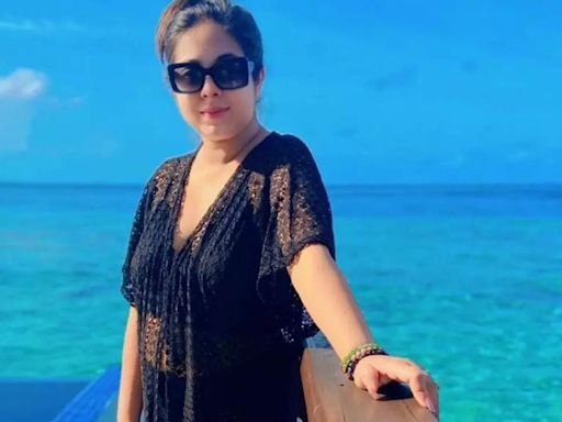 Sreemoye Chattoraj poses in a lacy black dress by the pool in Maldives - Times of India