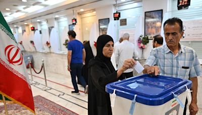 Iran Holds Runoff Presidential Vote Pitting Hard-line Former Negotiator Against Reformist Lawmaker - News18