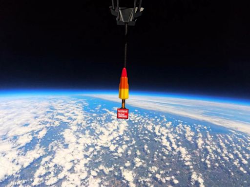 Out of this world! Woman scoffs rocket lolly after sweet treat blasted into space