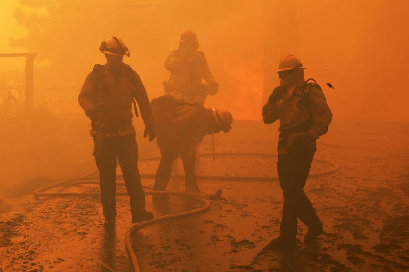 Fires besiege Southern California mountain communities; homes burn, 13 hurt