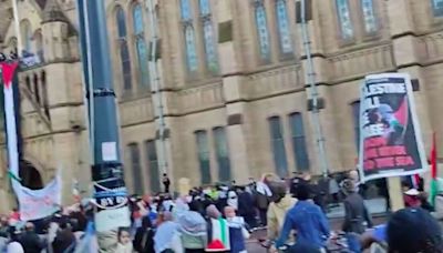 Moment pro-Palestine mob chants 'hold the line' as they push back cops