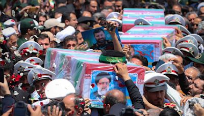 Iran begins burying late president, foreign minister and others killed in helicopter crash