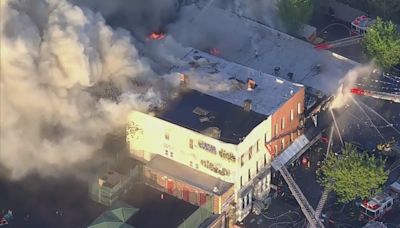 FDNY battle 5-alarm supermarket fire that spread to multiple buildings in Brooklyn