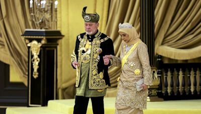 Malaysia honors a new king in coronation marked by pomp and cannon fire