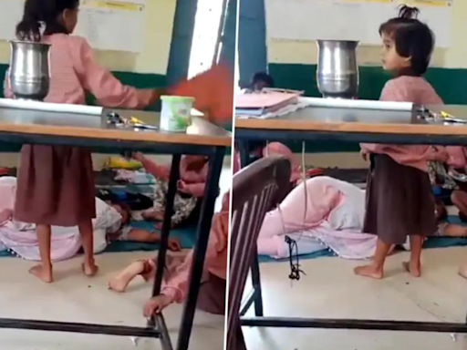 UP teacher in Aligarh naps in classroom as primary school kids found fanning her. Video goes viral - The Economic Times