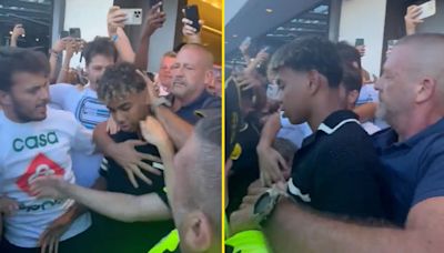 Security struggle to keep fans back as Lamine Yamal is mobbed at airport