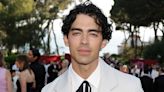 Joe Jonas’ amfAR Cannes Gala Look Draws Comparisons to Colonel Sanders, He Responds