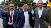 Pakistan swears in new parliament amid chaotic scenes as Imran Khan's followers protests vote count