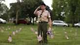 Hundreds of people place flags at Willamette National Cemetery ahead of Memorial Day