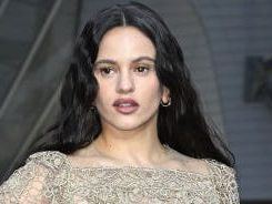 Rosalía goes braless and *almost* frees the nip in a lace naked dress