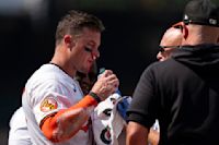 Orioles James McCann stays in game after taking fastball to his face